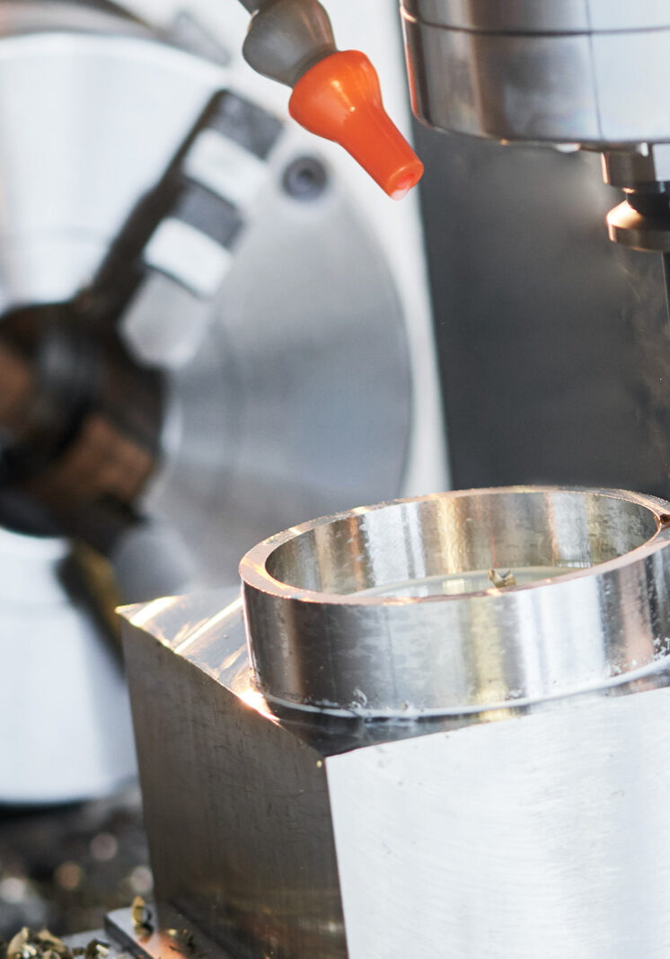 Milling metalworking process. Industrial precision CNC metal machining by vertical cutting mill